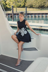 Black Crepe Sleeveless Mini Dress With Rhinestone Flower